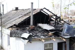 Burned house roof after fire
